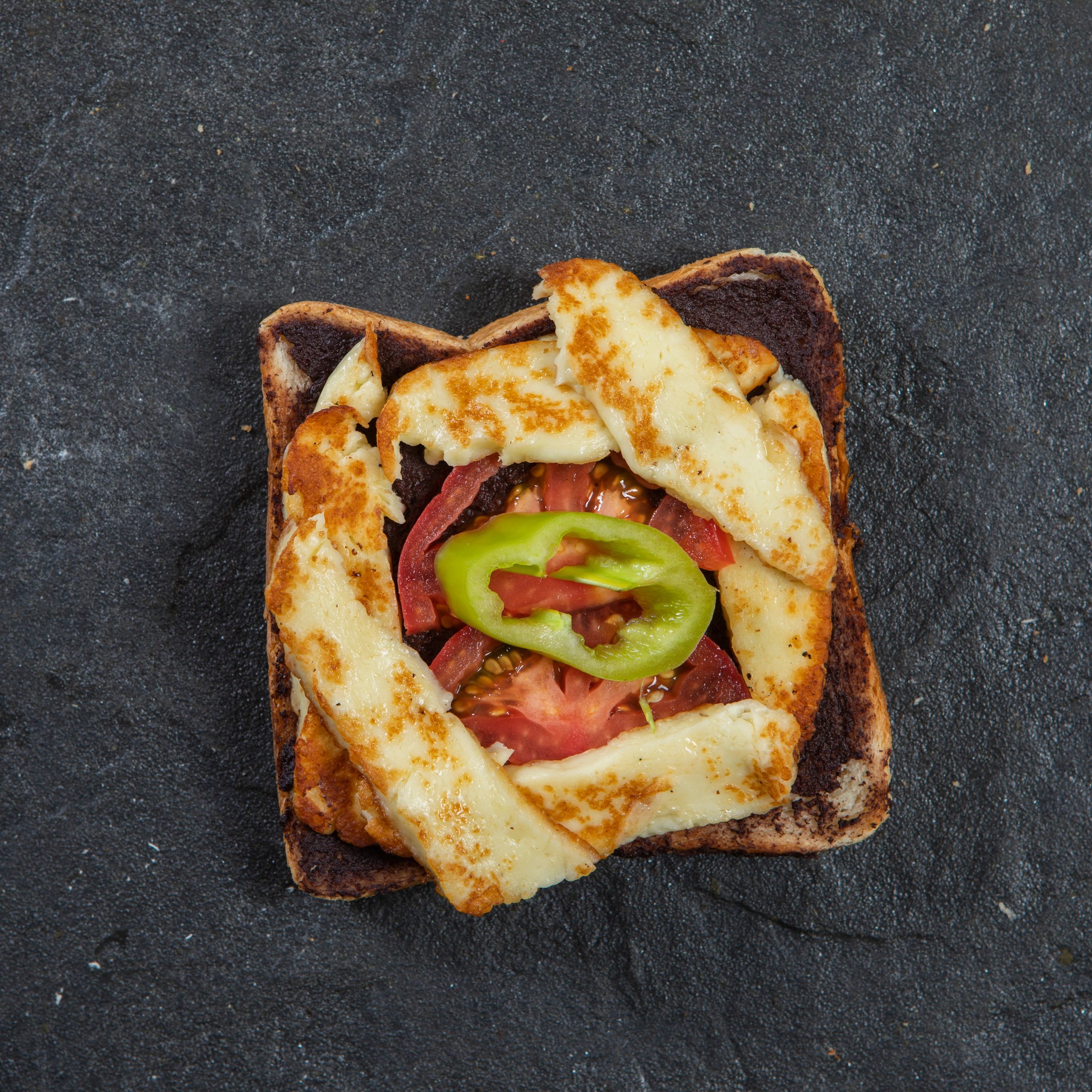 Paneer tikka sandwich in toasted bread with veggies