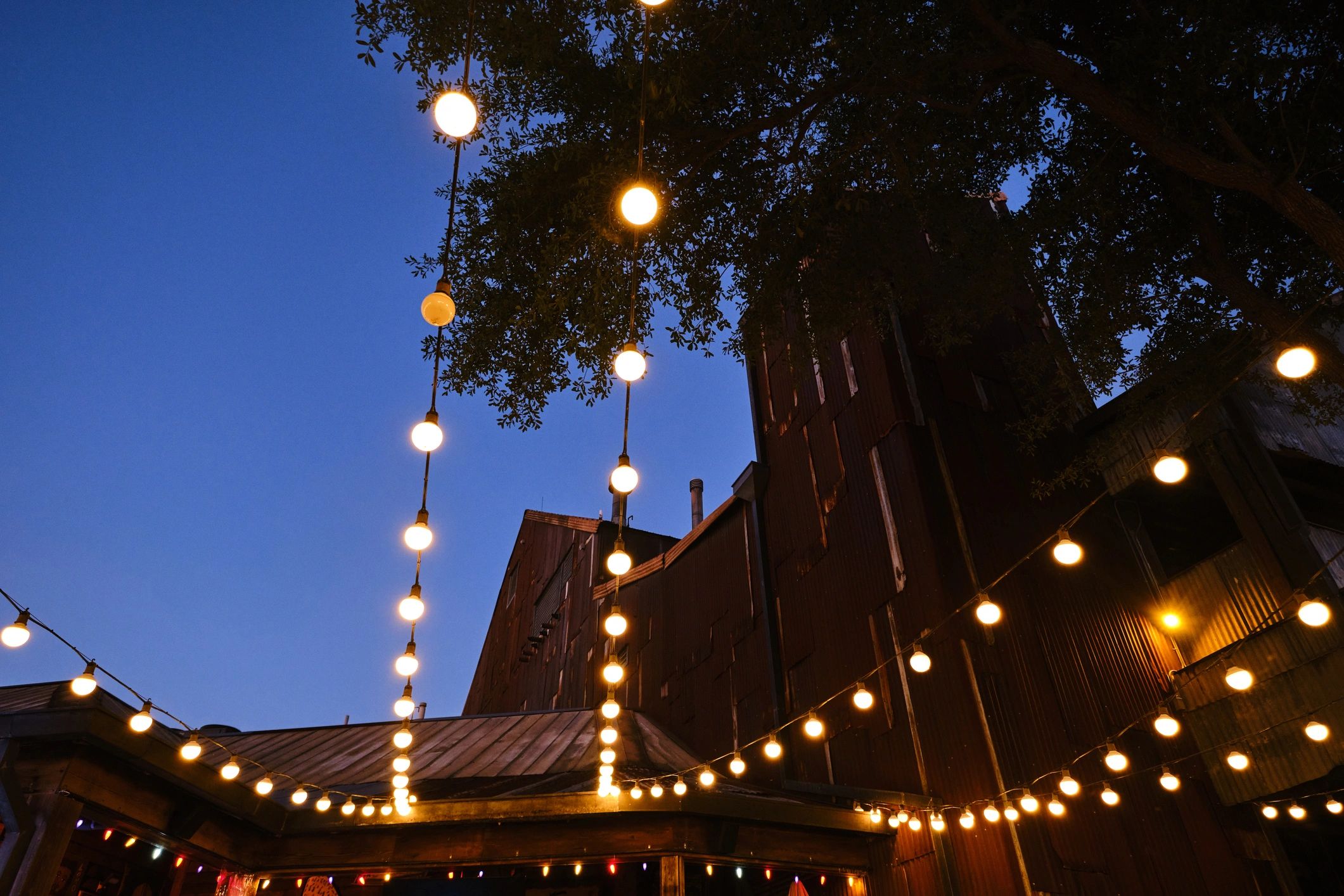 Warm hanging lights creating a cozy cafe atmosphere