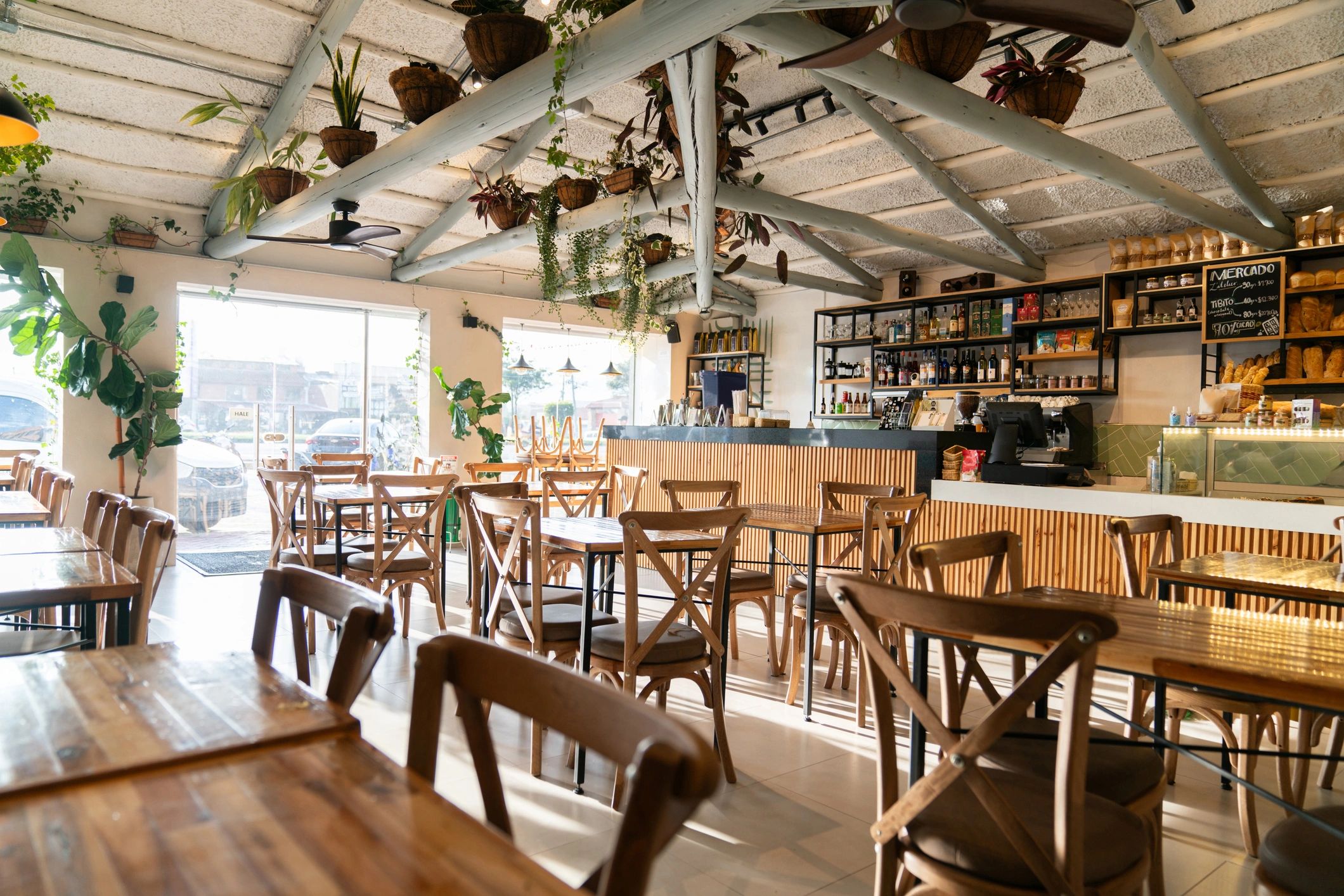 Warm, modern cafe interior with empty tables