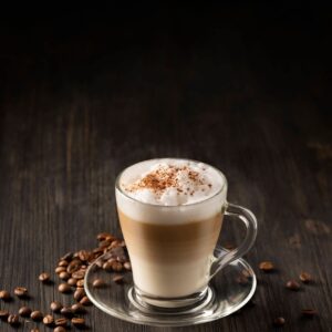 Latte Macchiato Coffee layered with Milk, Roasted Coffee Beans on black wooden background