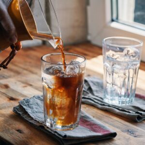 Preparing Iced Coffee Americano Served in a Glass